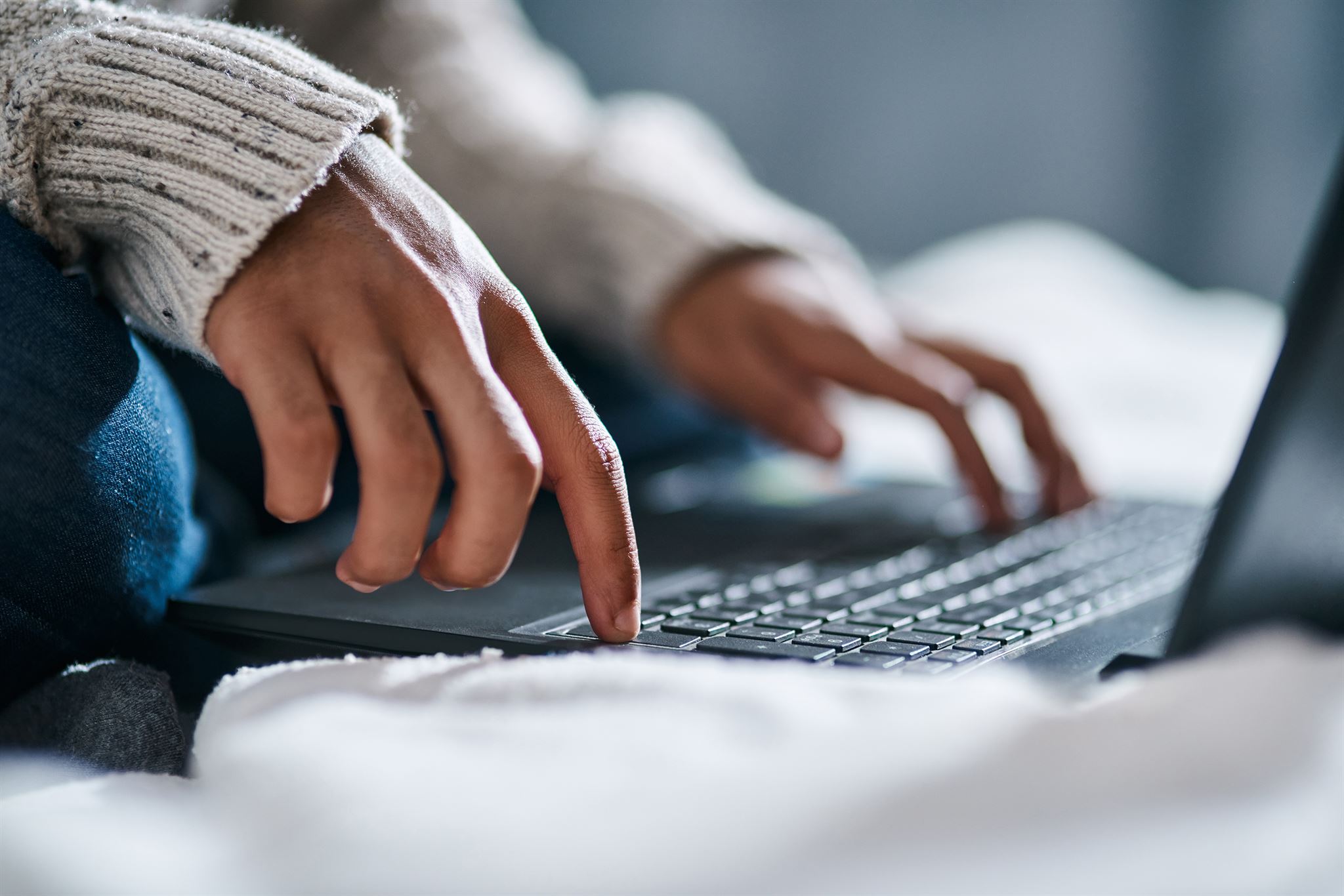 Person reporting an issue on laptop